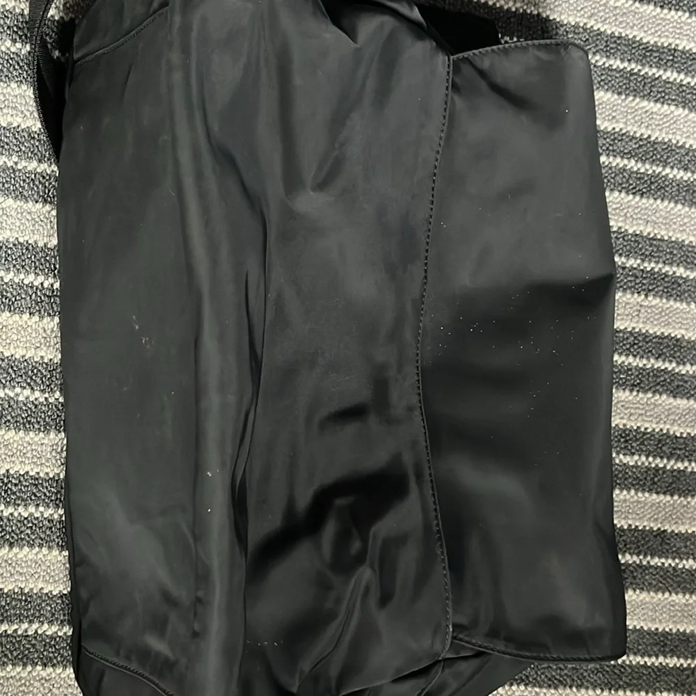 Tory Burch diaper bag. Gently used. black. Includes changing pad.
